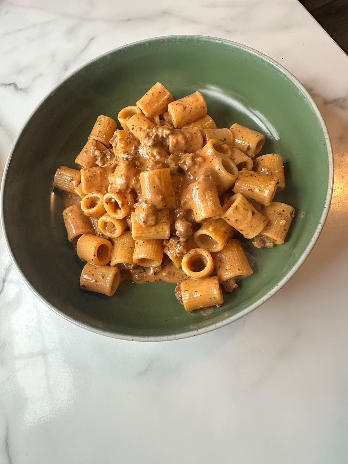 A bowl of creamy rigatoni on our kitchen table
